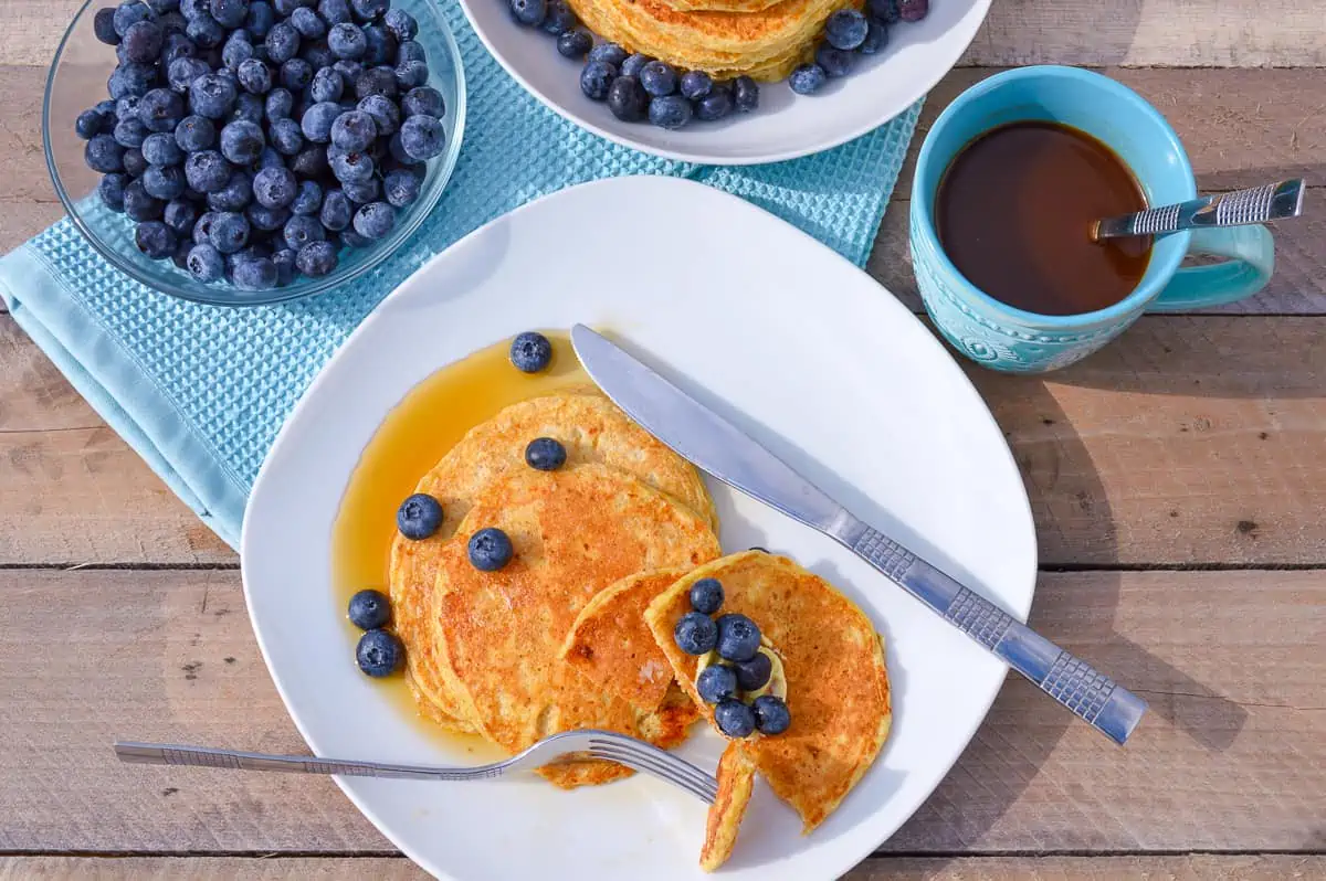 Fluffy Cottage Cheese Pancakes with maple syrup and blueberries
