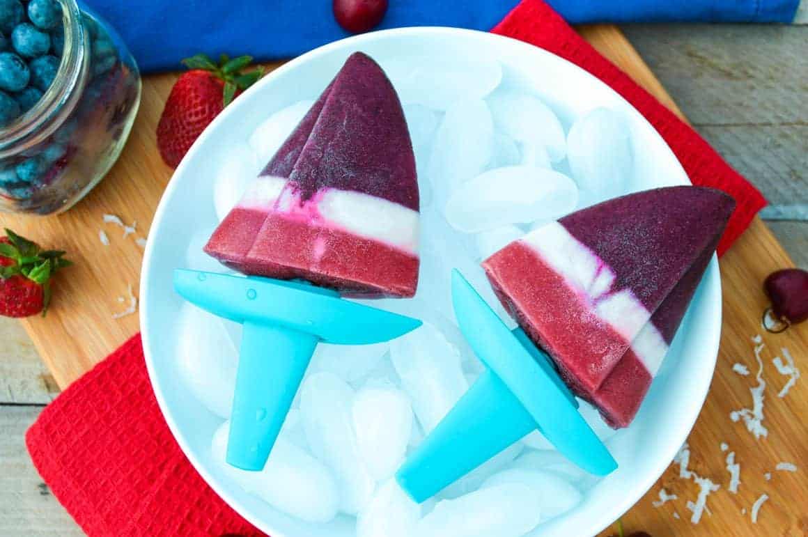Patriotic Red White & Blue Popsicles with berries on ice