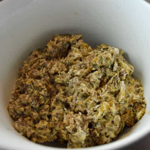 Stuffed mushroom mixture after cook added to a mixing bowl