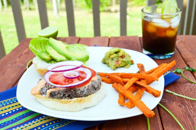 Cilantro Black Bean Burgers with sweet potato fries, guacamole and iced tea