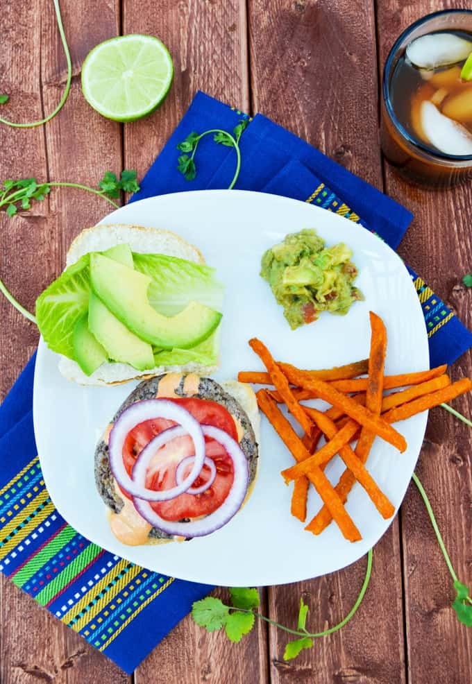 Plate with Cilantro Black Bean Burger, sweet potato fries and iced tea