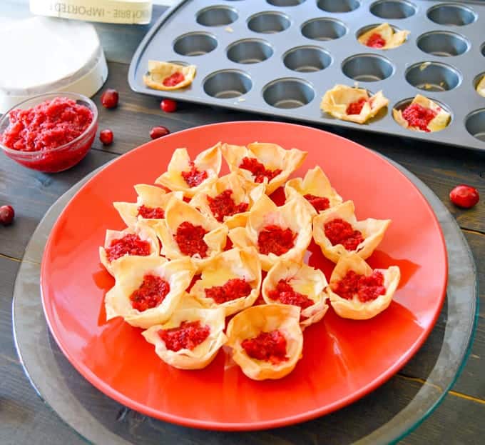 Brie & Cranberry Relish Phyllo Bites plated with relish and mini muffin pan