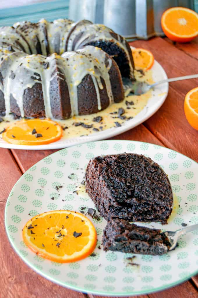 orange chocolate bundt cake slice on plate with orange slice