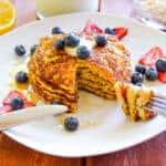 Lemon Buttermilk Rolled Oat Pancakes plated with berries
