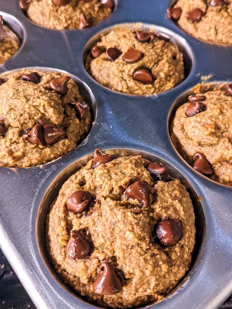 Flourless Banana Oat Muffins in Muffin pan close up after baking