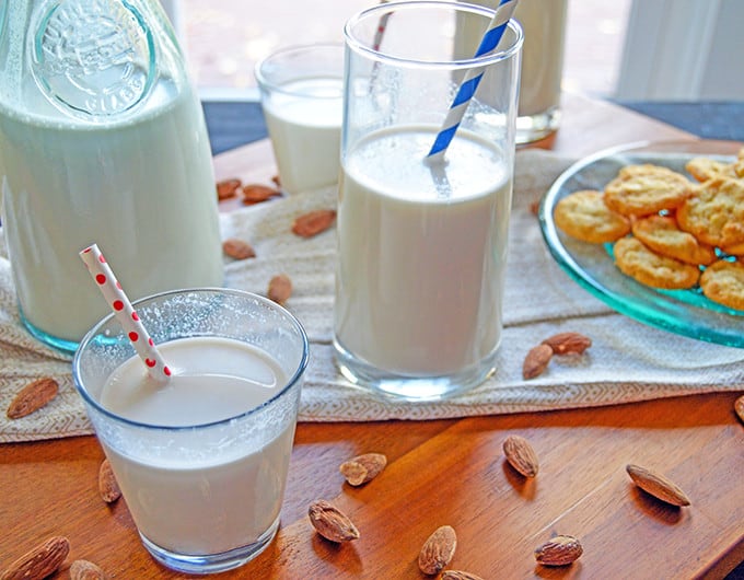 Homemade Almond Milk with cookies and almonds