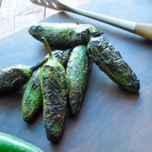 Grilled jalapenos charred ready to peel