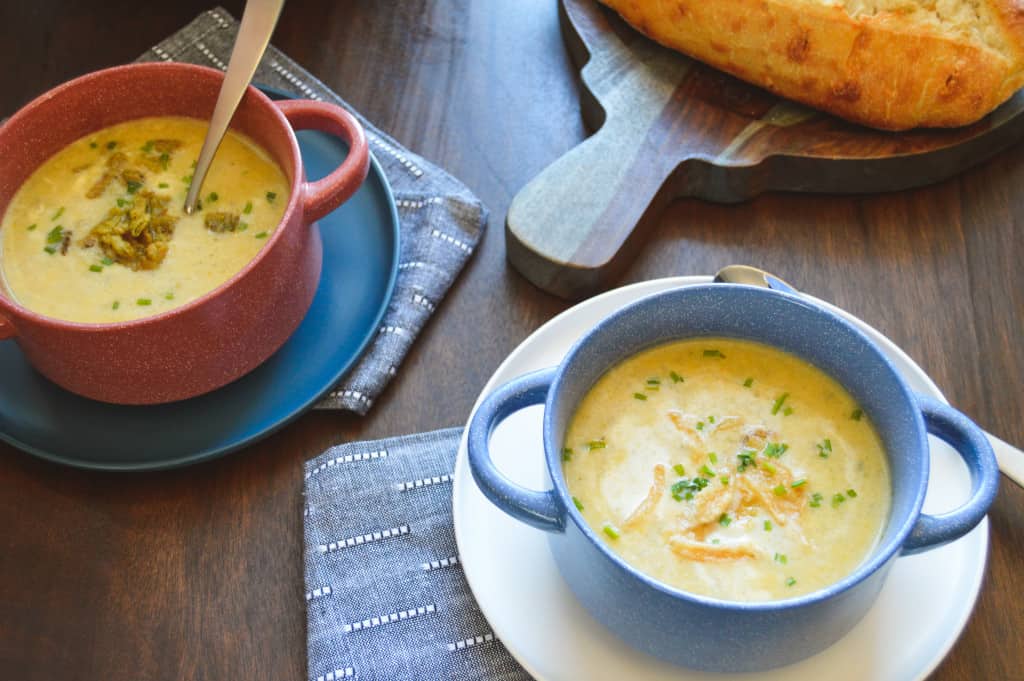 Potato Leek Soup with bread loaf, spoons and Instant Pot