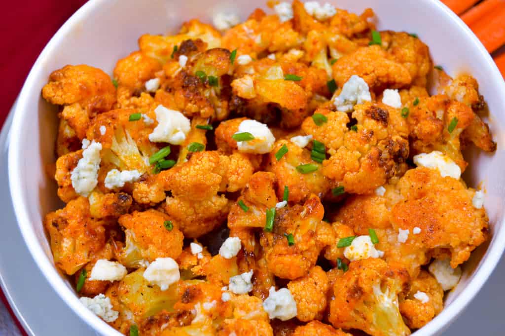 Buffalo Cauliflower Up close with blue cheese crumbles and chives