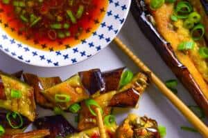 Spicy Air Fryer Japanese Eggplant with Asian inspired dressing and chopsticks