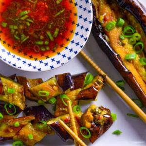 Spicy Air Fryer Japanese Eggplant with Asian inspired dressing and chopsticks