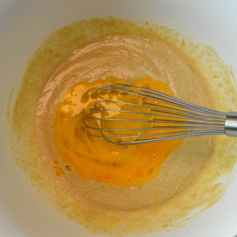 Adding egg to butter, brown sugar, salt, and cream