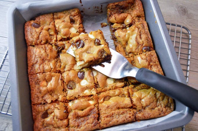 Blondies cut into 16-2 inch squares in baking dish oce wire rack