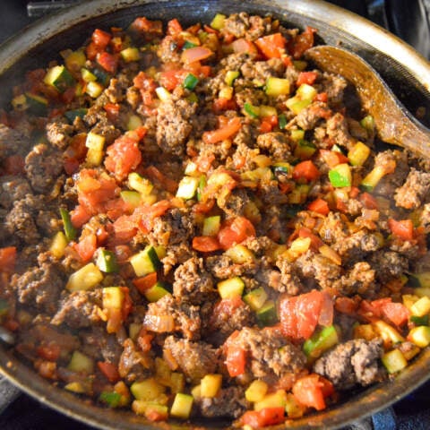 Add cooked beef back to skillet with vegetable mixture.